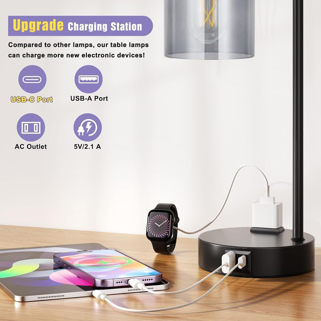 Table lamp with multiple charging ports on a desk, including USB-C, USB-A, AC outlet, and smartphone charging.