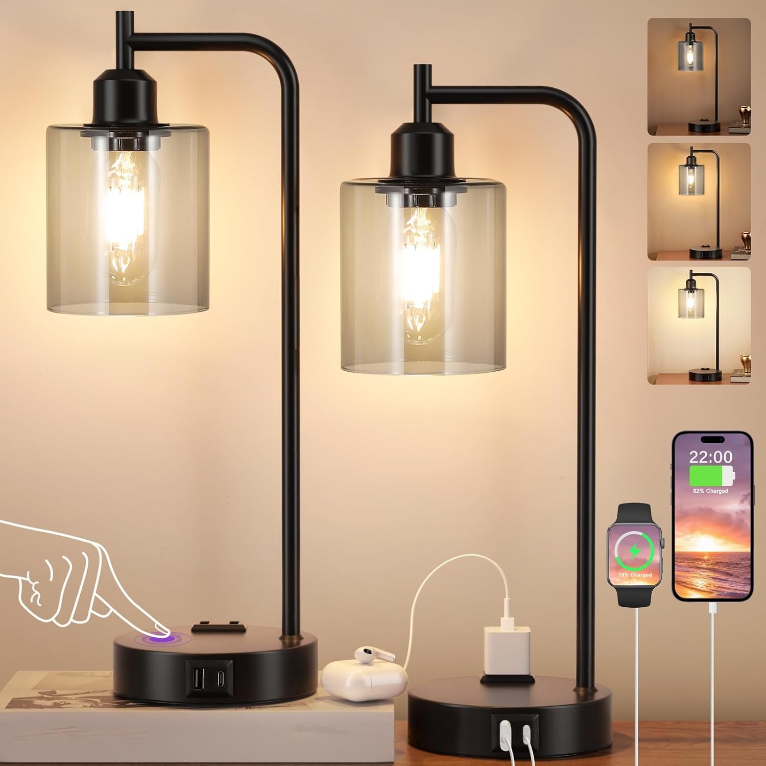 Modern black table lamp with glass shade on a wooden surface, surrounded by smartphone, smartwatch, and power adapter.