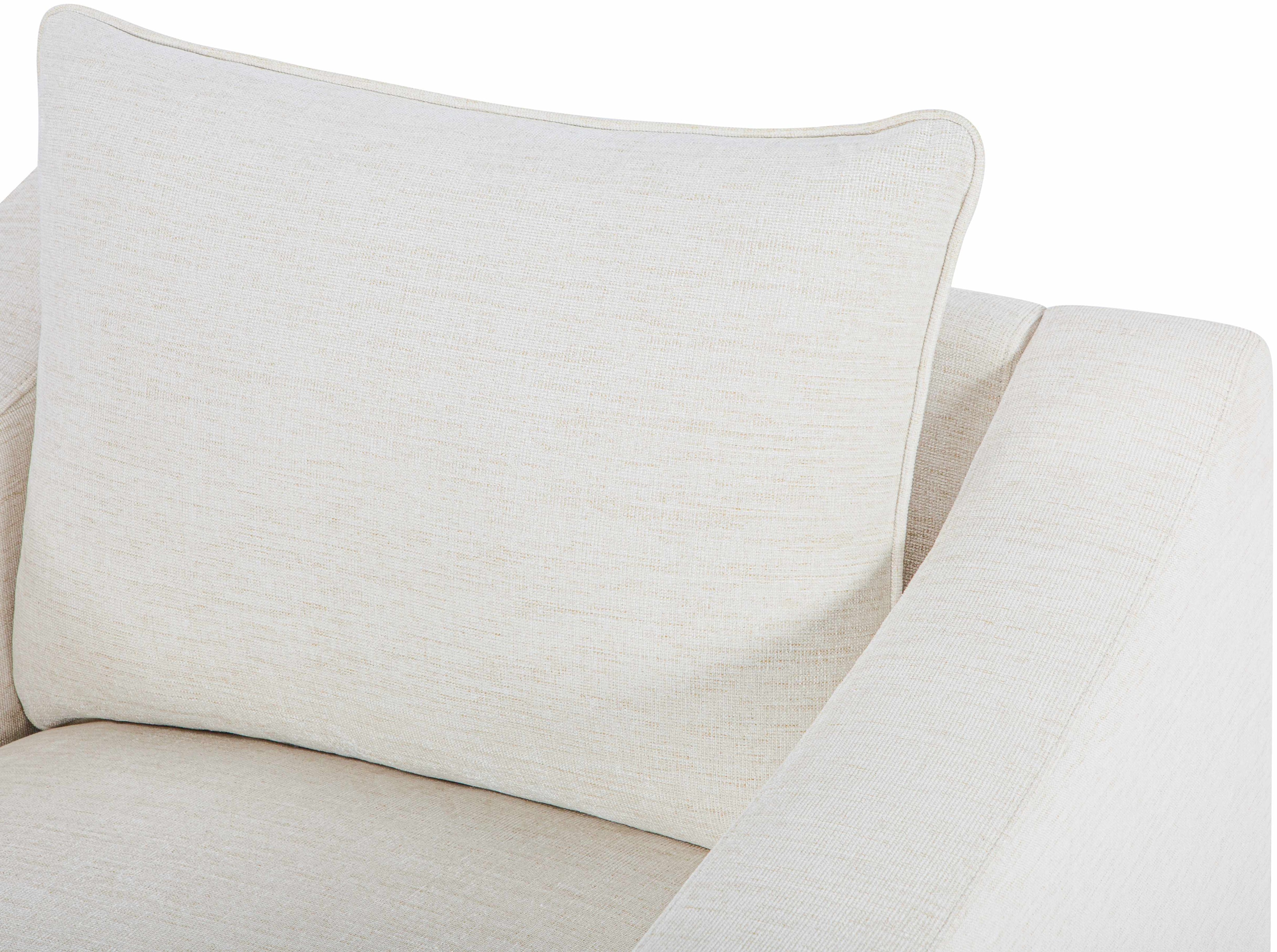 Contemporary Scandinavian-style chair, sleek minimalist seating, armchair in a room, beige accent chair with a pillow