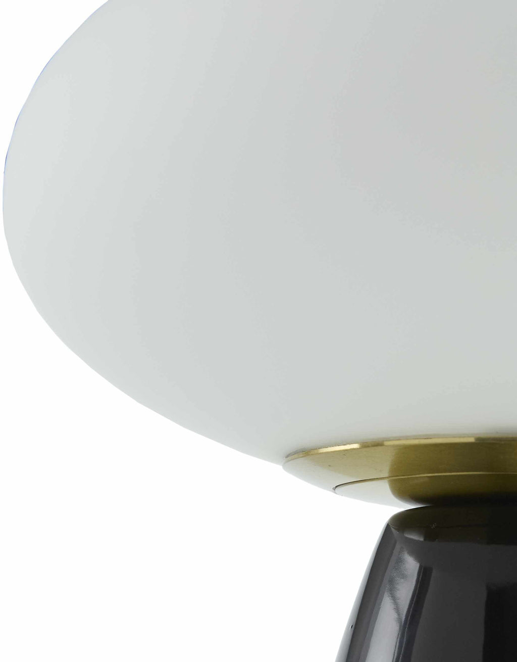 Contemporary black glass lamp on a white background close-up