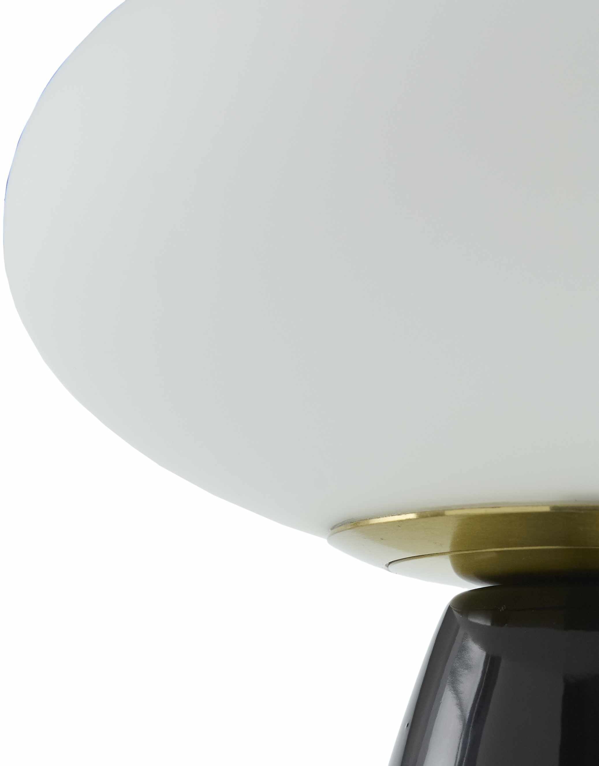Contemporary black glass lamp on a white background close-up