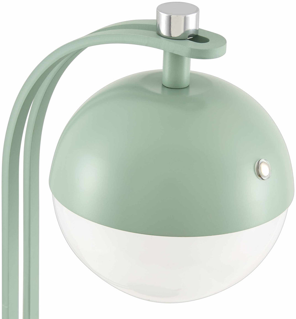 Detail view of lamp’s green iron base and white interior shade