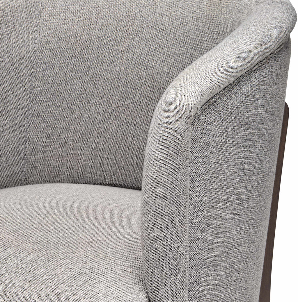 Gray upholstered chair with a focus on texture and design.