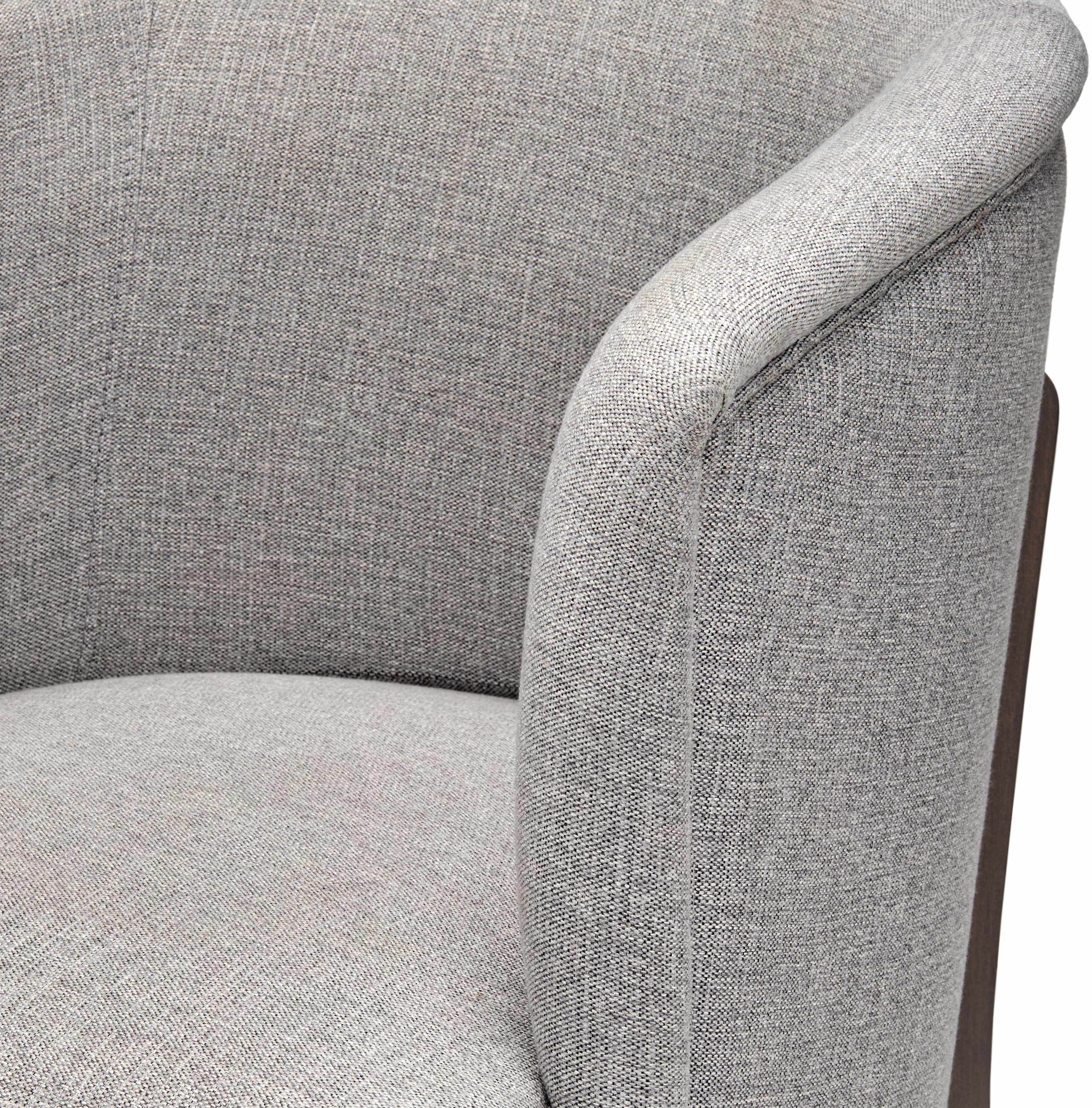 Gray upholstered chair with a focus on texture and design.
