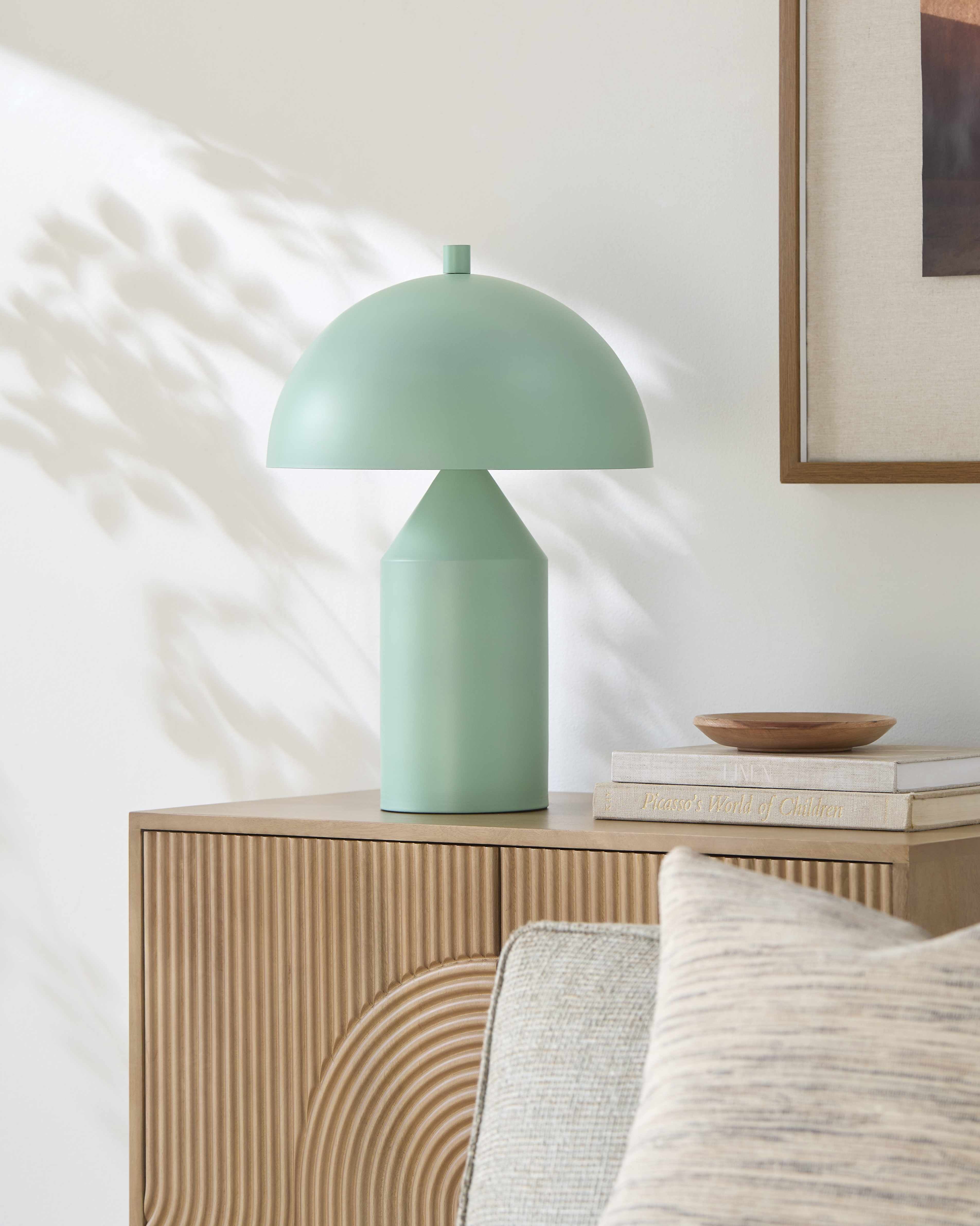Green metal shade table lamp with E-26 bulb socket in a contemporary stylish  living room