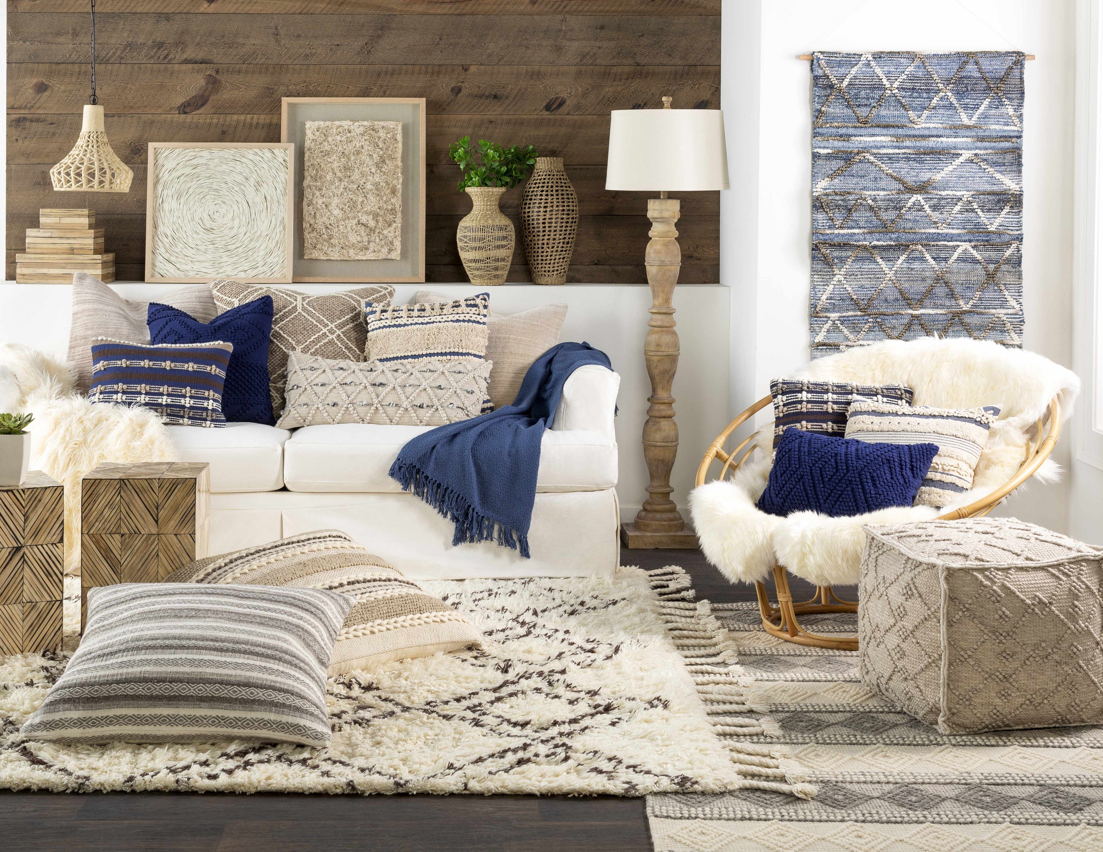 Cozy living room with a white sofa, decorative pillows, and a wooden floor.
Hand Woven Wool Pouf cube-shaped in a modern living room