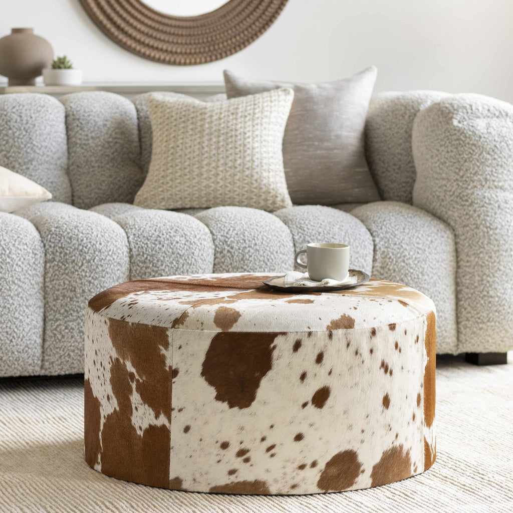 Modern Scandinavian ottoman with natural textured upholstery and wooden base contemporary sophisticated design in a modern cozy living room