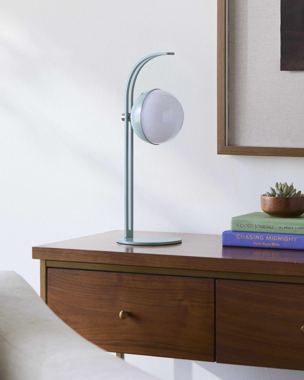 Modern table lamp on side table in living room interior